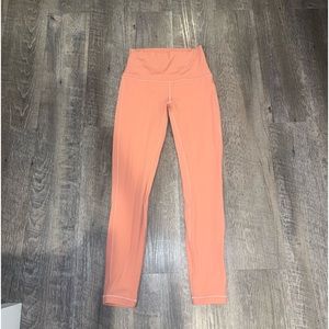 peach colored lululemon size 4 leggings